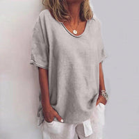 Relaxed fit blouse featuring a stylish V-neck design, perfect for casual outings and comfortable wear. 1