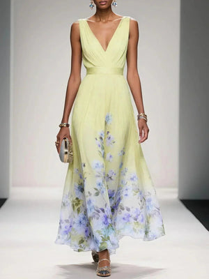 Floral print dress featuring a wrap-inspired neckline and a flowing silhouette, perfect for spring and summer occasions. 2