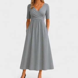 Elegant midi dress featuring a stylish V-neckline and a flattering silhouette, perfect for any occasion. 0